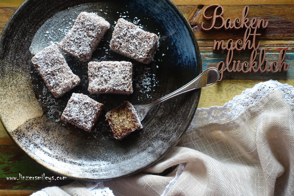 Lebkuchen-Lamingtons, beschwipst, mit Rum, alkoholisch, feine Rumnote, Lebkuchen, backen für Weihnachten, weihnachtlich, Gewürze, Kokos, Lamingtons, getränkte Kuchenwürfel, mit Kakaoglasur, Kokosflocken, australisch, österreichisch, saftig, köstlich, Süßes, länger haltbar #linzersmileys